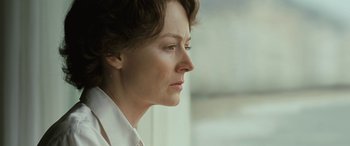 Movie still from “Reaching for the Moon” (2013), directed by Bruno Barreto – A person with short brown hair; Close Up shot, Low angle