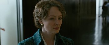 Movie still from “Reaching for the Moon” (2013), directed by Bruno Barreto – A person wearing a jacket; Close Up shot, Over the shoulder angle