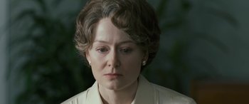 Movie still from “Reaching for the Moon” (2013), directed by Bruno Barreto – An older woman is looking down at her face; Close Up shot, Over the shoulder angle