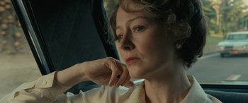 Movie still from “Reaching for the Moon” (2013), directed by Bruno Barreto – A person sitting in a car; Close Up shot, Low angle