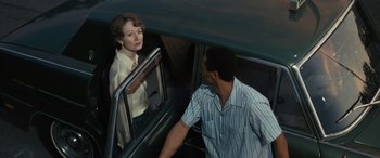 Movie still from “Reaching for the Moon” (2013), directed by Bruno Barreto – A man and a woman in the back of a car; Medium shot, Over the shoulder angle