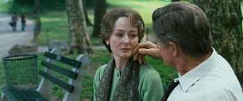 Movie still from “Reaching for the Moon” (2013), directed by Bruno Barreto – An older woman is getting her face waxed by an older woman; Close Up shot, Over the shoulder angle