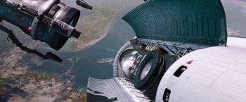 Movie still from “Red Planet” (2000), directed by Antony Hoffman – An image of a view from a space station window; Extreme Wide shot, Overhead angle