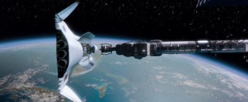 Movie still from “Red Planet” (2000), directed by Antony Hoffman – A view of a space station from a space ship; Extreme Wide shot, Overhead angle