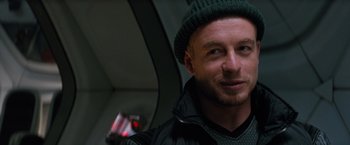 Movie still from “Red Planet” (2000), directed by Antony Hoffman – A person wearing a jacket and a hat; Close Up shot, Low angle
