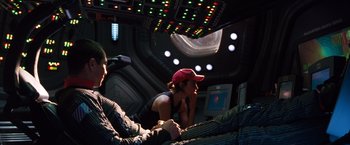 Movie still from “Red Planet” (2000), directed by Antony Hoffman – Two people are sitting in an airplane cockpit; Medium shot, High angle