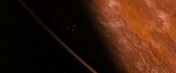 Movie still from “Red Planet” (2000), directed by Antony Hoffman – An image of an earth from space with the moon in the background; Extreme Wide shot, Overhead angle