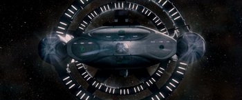 Movie still from “Red Planet” (2000), directed by Antony Hoffman – An overhead view of a spaceship in a space station; Extreme Wide shot, Overhead angle