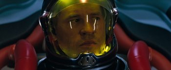 Movie still from “Red Planet” (2000), directed by Antony Hoffman – A person wearing a space helmet; Close Up shot, Low angle
