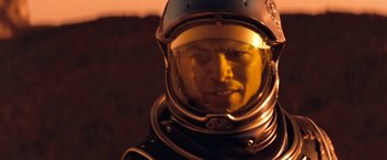 Movie still from “Red Planet” (2000), directed by Antony Hoffman – A person wearing a space suit; Close Up shot, Low angle