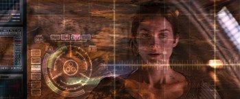 Movie still from “Red Planet” (2000), directed by Antony Hoffman – A woman is looking at the camera with a futuristic background; Close Up shot, Over the shoulder angle