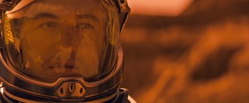 Movie still from “Red Planet” (2000), directed by Antony Hoffman – A person wearing a space suit; Close Up shot, Overhead angle