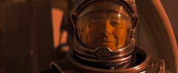 Movie still from “Red Planet” (2000), directed by Antony Hoffman – A person wearing a space suit; Close Up shot, Low angle