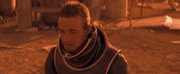 Movie still from “Red Planet” (2000), directed by Antony Hoffman – A person wearing a space suit; Close Up shot, High angle