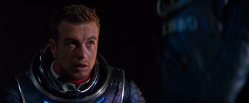 Movie still from “Red Planet” (2000), directed by Antony Hoffman – A person wearing a space suit; Close Up shot, Over the shoulder angle