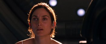 Movie still from “Red Planet” (2000), directed by Antony Hoffman – A woman's face in the dark; Close Up shot, Over the shoulder angle