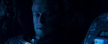 Movie still from “Red Planet” (2000), directed by Antony Hoffman – A person wearing a black shirt; Close Up shot, Low angle