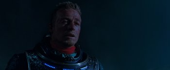 Movie still from “Red Planet” (2000), directed by Antony Hoffman – A person wearing a space suit; Close Up shot, Over the shoulder angle