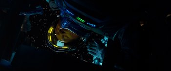 Movie still from “Red Planet” (2000), directed by Antony Hoffman – A person in a space helmet looking down at a screen; Close Up shot, Overhead angle