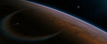 Movie still from “Red Planet” (2000), directed by Antony Hoffman – An image of an earth from space taken at night; Extreme Wide shot, Overhead angle
