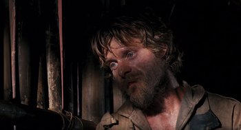 Movie still from “Rescue Dawn” (2006), directed by Werner Herzog – A person with a beard; Close Up shot, High angle