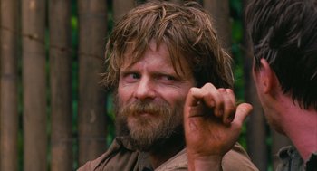 Movie still from “Rescue Dawn” (2006), directed by Werner Herzog – A person with a beard; Close Up shot, Over the shoulder angle