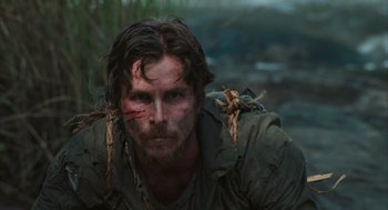 Movie still from “Rescue Dawn” (2006), directed by Werner Herzog – A person with a face paint; Close Up shot, Low angle