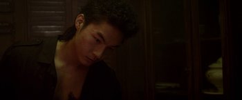 Movie still from “Revenge of the Green Dragons” (2014), directed by Andrew Loo – A young man is looking at the camera; Close Up shot, High angle