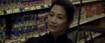 Movie still from “Revenge of the Green Dragons” (2014), directed by Andrew Loo – A person in a grocery store; Close Up shot, Over the shoulder angle