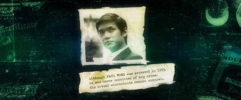 Movie still from “Revenge of the Green Dragons” (2014), directed by Andrew Loo – An old photo of a man with a quote from a book; Close Up shot, Overhead angle