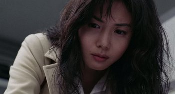 Movie still from “Ringu” (1998), directed by Hideo Nakata – A person with long hair; Close Up shot, Low angle
