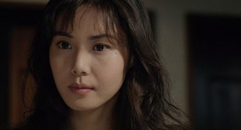 Movie still from “Ringu” (1998), directed by Hideo Nakata – A person with long hair; Close Up shot, Over the shoulder angle