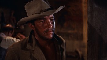 Movie still from “Rio Bravo” (1959), directed by Howard Hawks – A person wearing a hat; Close Up shot, Over the shoulder angle