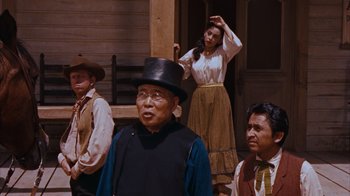 Movie still from “Rio Bravo” (1959), directed by Howard Hawks – A group of men and a woman standing next to each other; Medium shot, Low angle