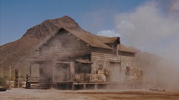 Movie still from “Rio Bravo” (1959), directed by Howard Hawks – An old wooden house in the middle of a desert; Extreme Wide shot, Low angle