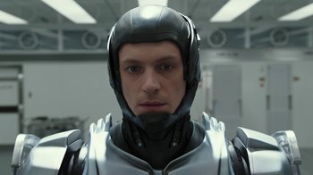 Movie still from “RoboCop” (2014), directed by José Padilha – A person wearing a helmet; Close Up shot, Low angle
