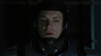 Movie still from “RoboCop” (2014), directed by José Padilha – A person wearing a helmet; Close Up shot, Low angle