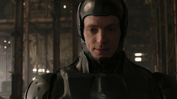 Movie still from “RoboCop” (2014), directed by José Padilha – A person wearing a helmet; Close Up shot, Low angle