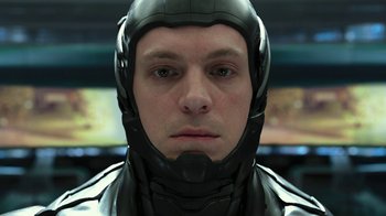 Movie still from “RoboCop” (2014), directed by José Padilha – A person wearing a helmet; Close Up shot, Low angle