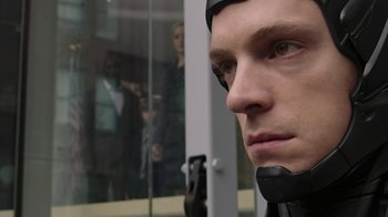 Movie still from “RoboCop” (2014), directed by José Padilha – A person wearing a helmet; Close Up shot, Low angle