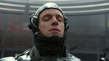 Movie still from “RoboCop” (2014), directed by José Padilha – A person with his eyes closed; Close Up shot, High angle