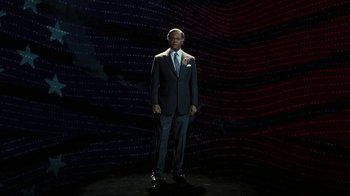 Movie still from “RoboCop” (2014), directed by José Padilha – A man in a suit and tie standing in front of a wall; Wide shot, High angle