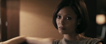 Movie still from “RocknRolla” (2008), directed by Guy Ritchie – A person with short black hair; Close Up shot, High angle