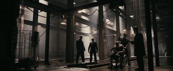 A group of men standing next to each other in a building