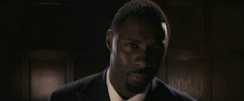 A person wearing a suit and tie