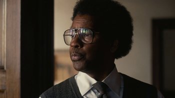 Movie still from “Roman J. Israel, Esq.” (2017), directed by Dan Gilroy – A person wearing glasses and a tie; Close Up shot, Low angle