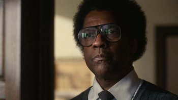 Movie still from “Roman J. Israel, Esq.” (2017), directed by Dan Gilroy – A person wearing a suit and tie; Close Up shot, Low angle