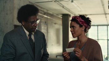 Movie still from “Roman J. Israel, Esq.” (2017), directed by Dan Gilroy – A man and a woman looking at a piece of paper; Medium shot, Over the shoulder angle