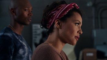 Movie still from “Roman J. Israel, Esq.” (2017), directed by Dan Gilroy – A woman wearing a head scarf standing next to a man; Close Up shot, Over the shoulder angle