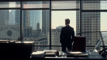 Movie still from “Roman J. Israel, Esq.” (2017), directed by Dan Gilroy – A man standing in front of a window; Wide shot, Over the shoulder angle